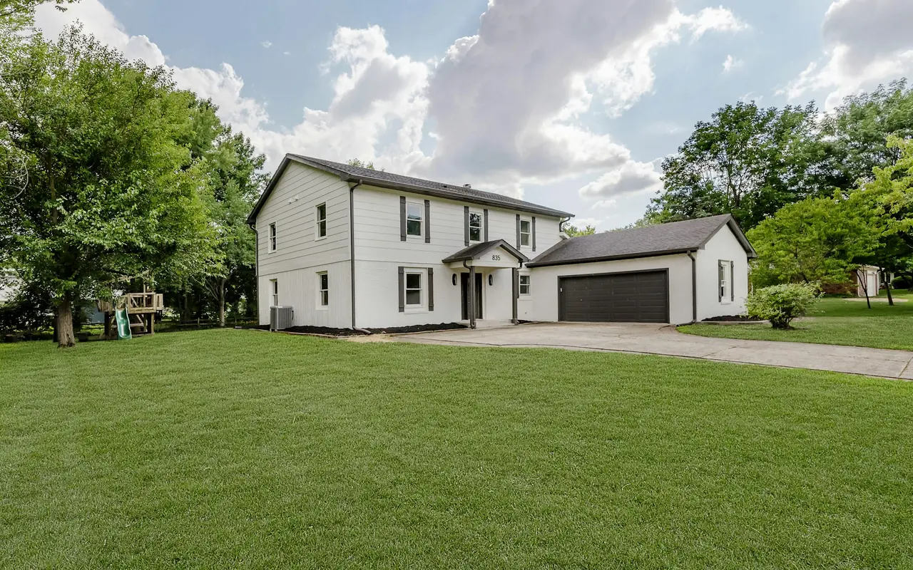 Two-story colonial home with a detached two-car garage